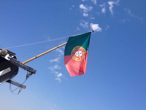 Portugal flag against blue sky background