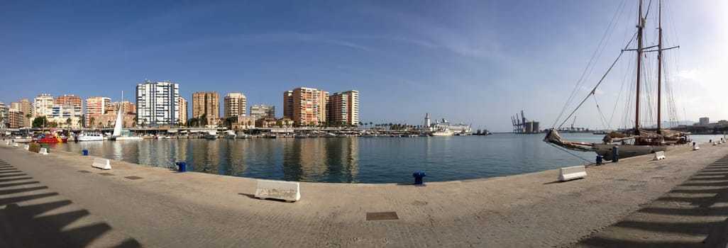 Harbor coastline panorama with sailing ship in the city of Malaga in Spain