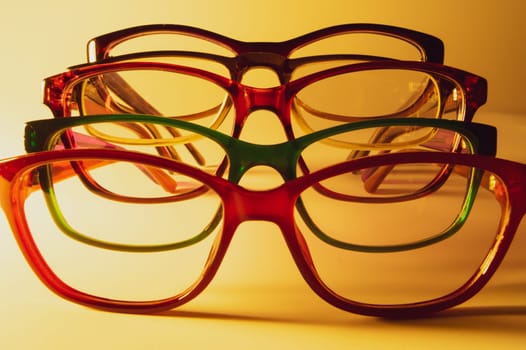 Glasses close up artistic shot. rimmed eyeglasses background with copy space. various reading glasses