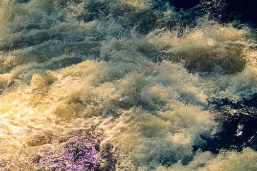 Water stream with foam. falling river water. waterfall flow. water background