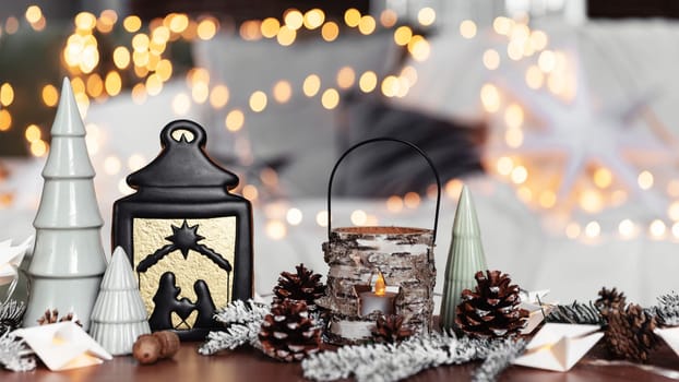 Christmas or New Year composition with various home decorations, different symbolic toys composed and ordered at coffee table with blurred Christmas lights background at sofa white cover. Family time
