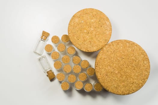 Empty little bottles with cork stopper isolated on white. glass vessels. transparent containers. test tubes. various corks
