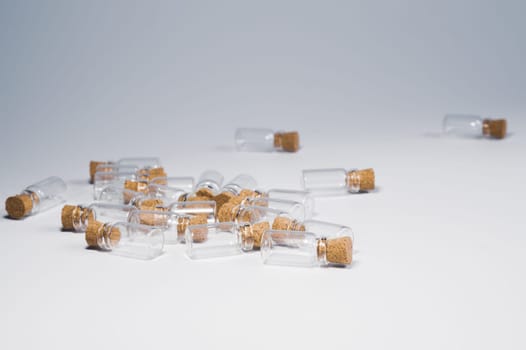 Empty little bottles with cork stopper isolated on white
