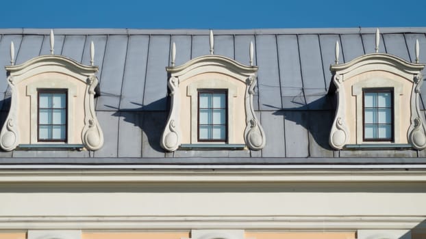 Roof with windows. attic of the house with the sky background