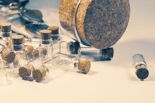 Little bottles with cork stopper isolated on white. big bottle with cork. glass vessels. transparent containers. test tubes