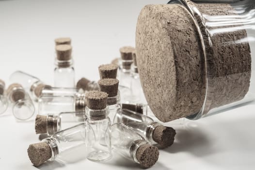 Little bottles with cork stopper isolated on white. big bottle with cork. glass vessels. transparent containers. test tubes