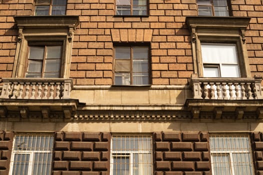 Brown brick wall with decorated windows background