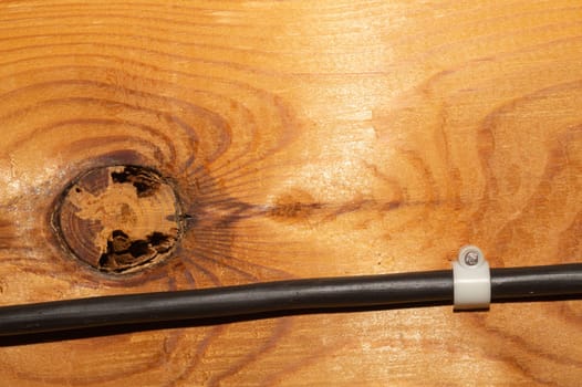 Old wood background. wooden texture with a cable
