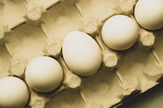 White eggs in carton box background. food ingredient. protein nutrition. healthy breakfast. poultry egg