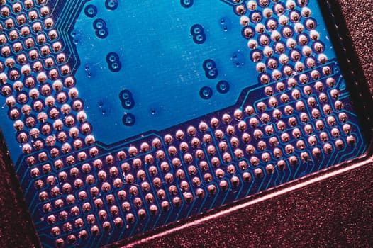 Processor pins macro. computer motherboard close up. cpu pins on a circuit board. micro elements of computer central processor unit. modern technologies abstract background