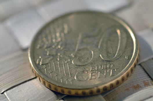 euro coins on a wicker mat