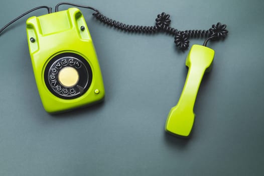 Classic phone with handset. vintage green telephone with phone receiver. office background. old communication technology. copy space