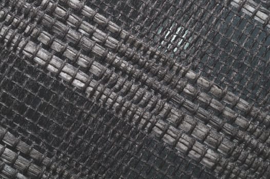 Braided fibers close up. woven texture. wicker background. knitted surface. weaving pattern. weaving from threads