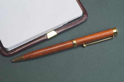 Blank paper of notepad with wooden pen. office supplies. notebook with white page. copy space