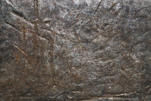 Anvil surface with scratches and traces from hammer. rough steel background. grunge metal texture