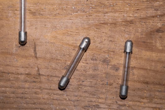 Fuse on wooden background. safety device for overcurrent protection. protection of an electrical circuit