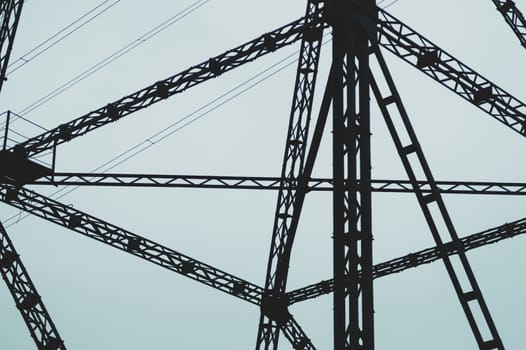 Detail of power line post. high voltage tower with the sky. industrial background
