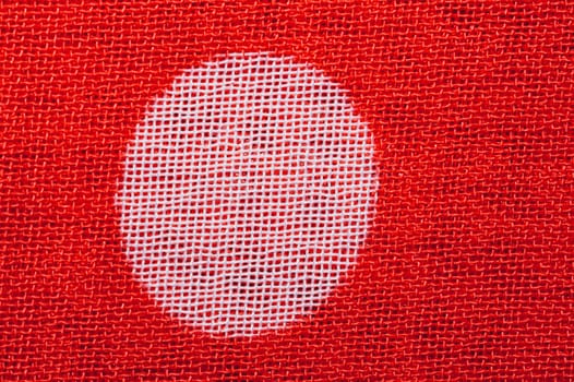 Fabric macro texture. knitted textile close up. woven background. red and white fibers