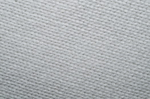 Knitted fabric macro. woven material background. textile texture close up