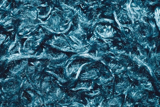 Soft fabric texture. turquoise extile with curly fibers. wool background close up
