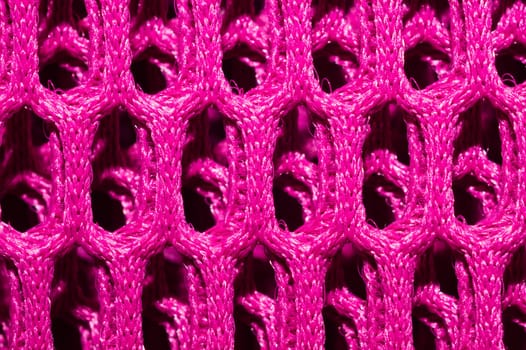 Pink fabric texture macro. abstract knitted pattern. woven material. textile background