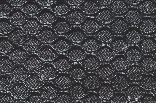 Black fabric texture close up. knitted pattern. woven material. textile background