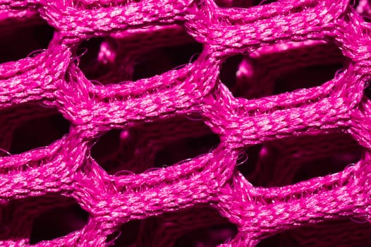 Pink fabric texture macro. abstract knitted pattern. woven material. textile background