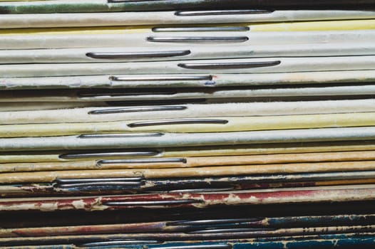 Stack of old magazines. pile of retro newspapers. vintage journals lie on top of each other