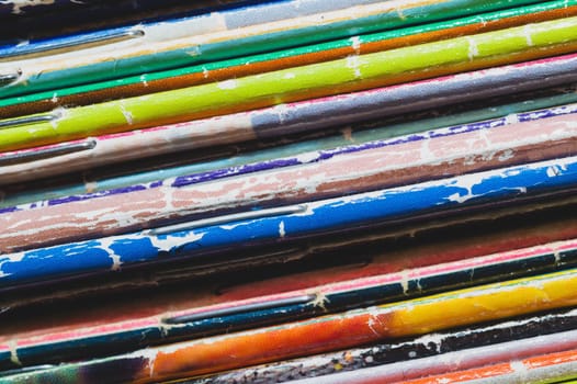Stack of old magazines. pile of retro newspapers. vintage journals lie on top of each other. colorful background from the printed publications