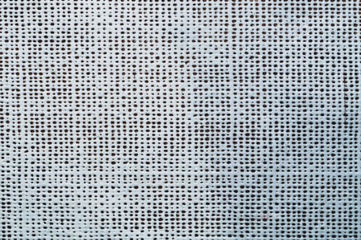 Rubber surface with uneven holes. white plastic texture with dots. abstract background
