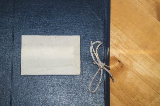 Vintage folder for paper with blank label. old folder for documents lies on a wooden table. copy space