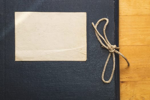 Vintage folder for paper with blank label. old folder for documents lies on a wooden table. copy space