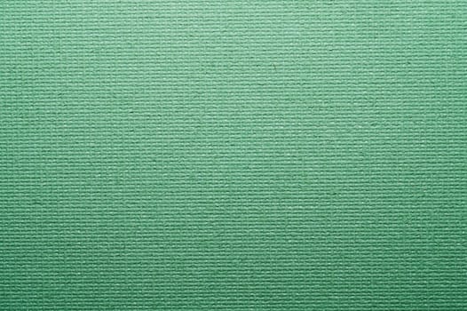 Painted cardboard surface close up. rough texture. abstract green background