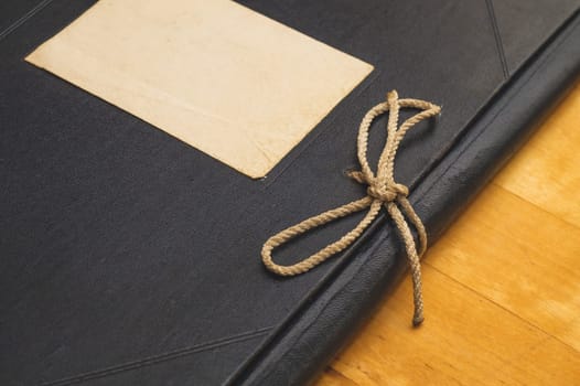 Vintage folder for paper with blank label. old folder for documents lies on a wooden table. copy space