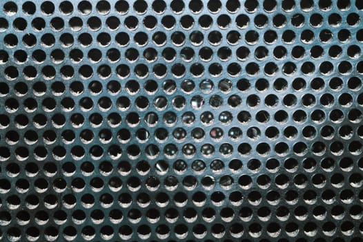 Grid pattern surface. dusty speaker mesh texture close up. perforated plastic. abstract background