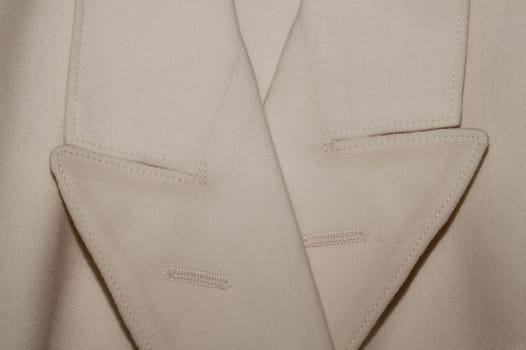 Vintage jacket detail. old suit close up. beige clothes