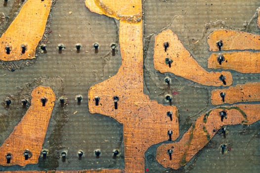 Handmade circuit board with soldered copper tracks. industrial background. textolite with soldering