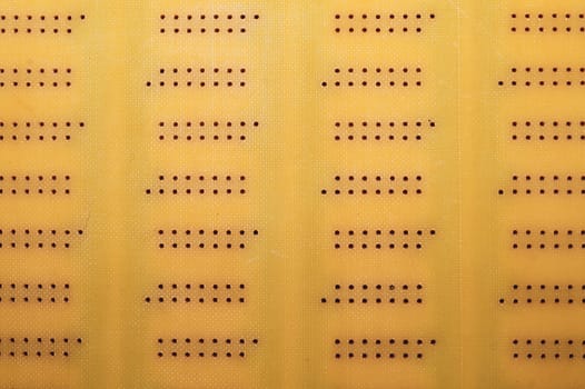 Dotted textolite surface. template for soldering the circuit. perforated background