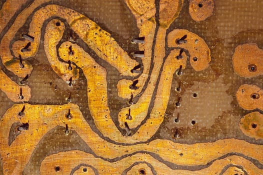 Handmade circuit board with soldered copper tracks. industrial background. textolite with soldering