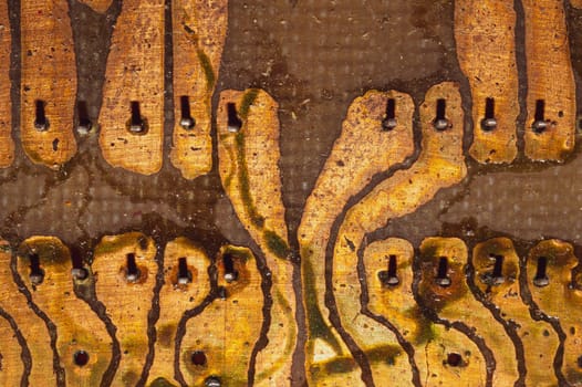 Handmade circuit board with soldered copper tracks. industrial background. textolite with soldering