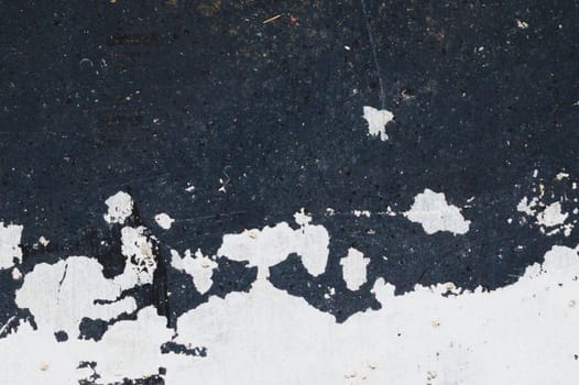 Black steel plate with white paint spots. metal surface with paint splashes. grunge texture. iron background