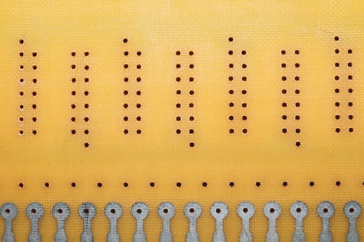 Dotted textolite surface. template for soldering the circuit. perforated background