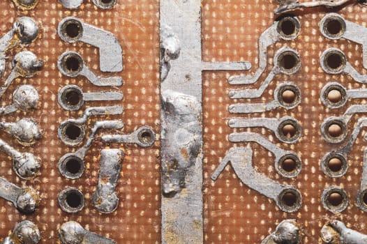 Handmade circuit board. industrial background. textolite with soldered tracks