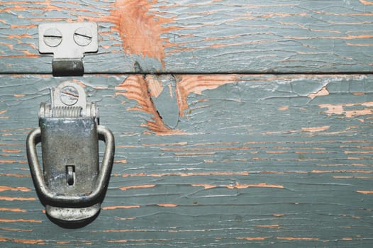 Wood background with cracked paint. detail of vintage wooden locker