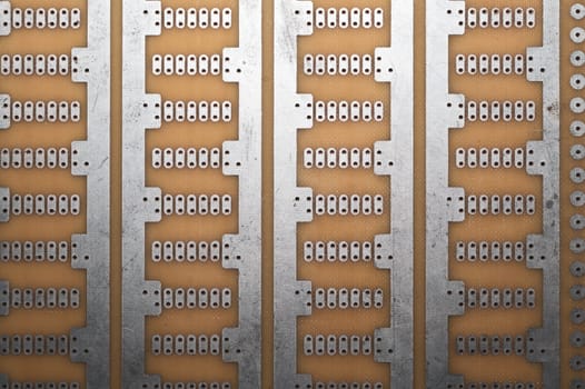 Printed circuit board without elements. textolite surface. template for soldering the circuit. perforated background