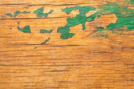 Rough wood with green paint spots. old wooden texture. scratched and cracked surface