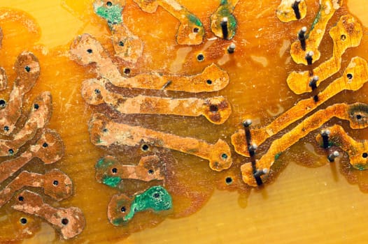 Handmade circuit board with copper tracks. industrial background. radio engineering background. textolite with soldering