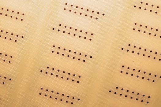 Dotted textolite surface. template for soldering the circuit. perforated background