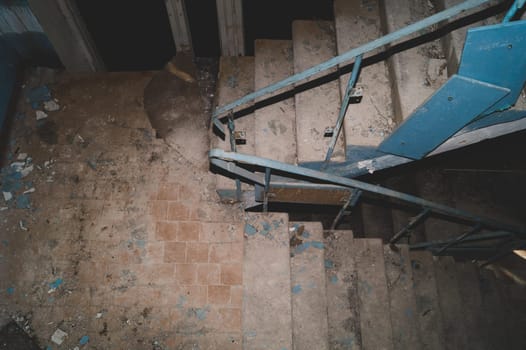 Staircase in an abandoned building. destroyed house