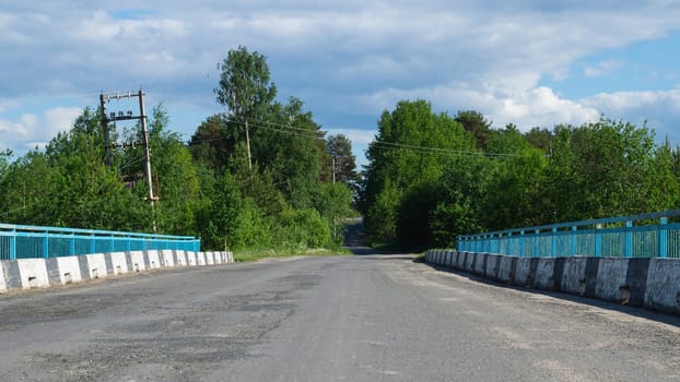 Bridge in the countryside. rural landscape. summer day. country road in the village